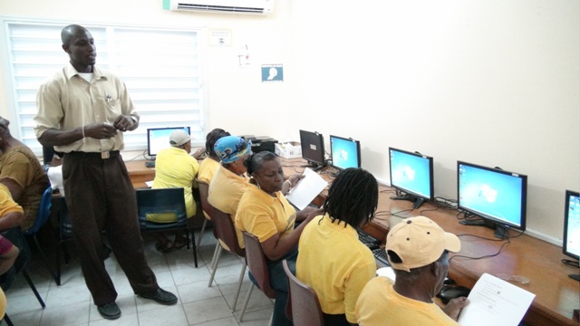 Sean Joseph, Facilitator of the Computer Skills Course for Seniors instructing trainees at the VOJN Primary School Computer Laboratory on February 01 2016