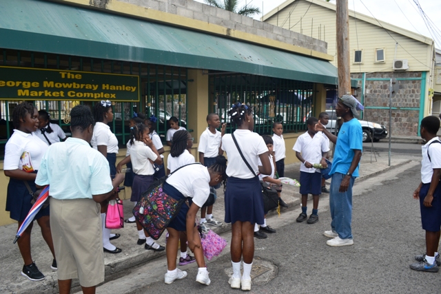 Students of the Nevis Academy on a tour at the George Mowbray Market Complex on April 18, 2016, led by Lemuel Pemberton and organised by the Ministry of Tourism as part of its Exposition Nevis