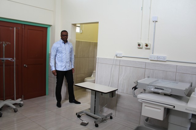 Minister of Health on Nevis Hon. Mark Brantley takes a first-hand look at new tile work at the Alexandra Hospital’s maternity ward on July 15, 2016