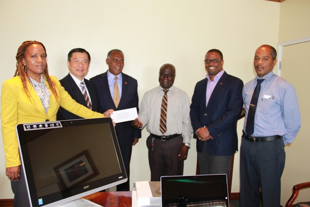 Republic of China (Taiwan)’s Resident Ambassador to St. Kitts and Nevis His Excellency George Gow Wei Chiou (second from left) presents almost $200,000 cheque to (l-r) Premier of Nevis and Minister responsible for Ports Hon. Vance Amory, General Manager of the Nevis Solid Waste Management Authority Andrew Hendrickson, Deputy Premier of Nevis and Minister of Health Hon. Mark Brantley and Hospital Administrator Gary Pemberton with Permanent Secretary in the Ministry of Health Nicole Slack-Liburd at the extreme left at a handing over ceremony at the Alexandra Hospital conference room on July 25, 2016