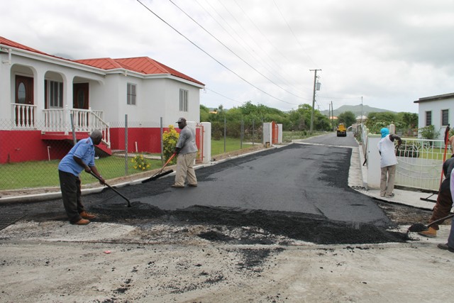 Members of the Public Works Department putting finishing works on the new Lower Farms/Bath Plain road on July 29, 2016