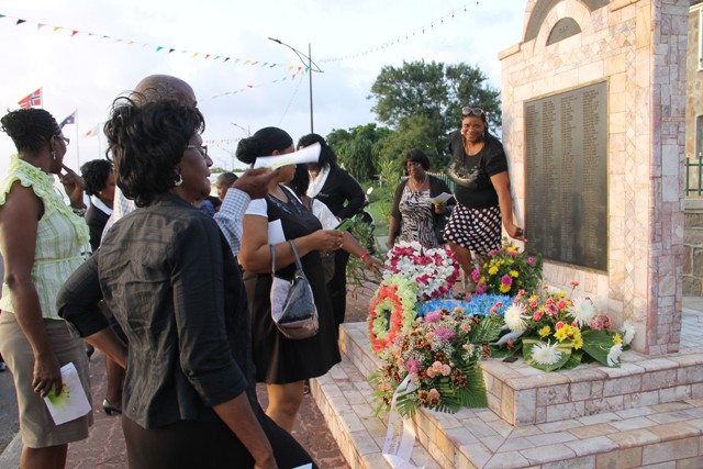 Some family and well-wishers of the 233 victims who perished during the MV Christena tragedy looking at the monument mounted on Samuel Hunkins Drive in their loved ones’ honour adorned with flowers at the 46th annual Memorial Service at the Hamilton Museum Grounds on August 01, 2016