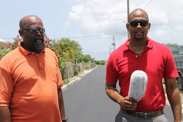 (L-r) Daniel Williams, Public Works Department Supervisor of the Road Division and Raoul Pemberton, Director of Public Works Department in the Nevis Island Administration at the Lower Farms/Bath Plain road on July 29, 2016
