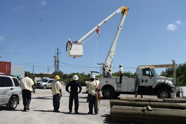 Linesmen from the Transmission and Distribution Department at the Nevis Electricity Company Limited, learning how to mount a rescue mission with the bucket truck from The Barbados Power & Light Company Limited’s Technical Trainer Curtis Brewster at Prospect on September 14, 2016