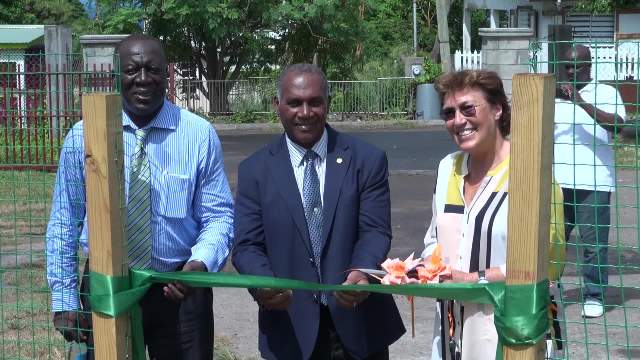 Premier of Nevis and Minister of Education Hon. Vance Amory cuts the ribbon to the new shade house   donated by the Government and people of New Zealand with (left) Augustine Merchant, Coordinator of the Inter-American Institute for Cooperation on Agriculture in St. Kitts and Nevis and (right) New Zealand’s High Commissioner to St. Kitts and Nevis Her Excellency Jan Henderson
