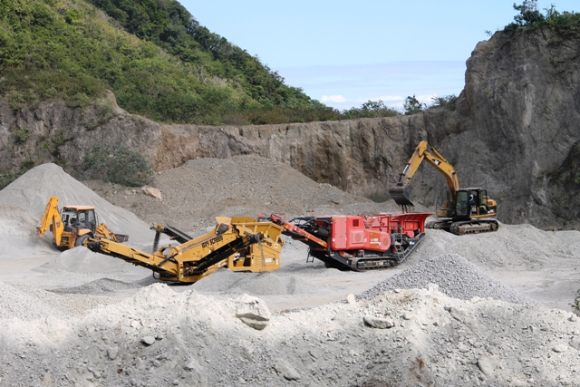 Stone crushing equipment in operation at the Nevis Island Administration-owned New River Quarry, paid for by a loan from the St. Christopher and Nevis Social Security Board to the Nevis Housing and Land Development Corporation
