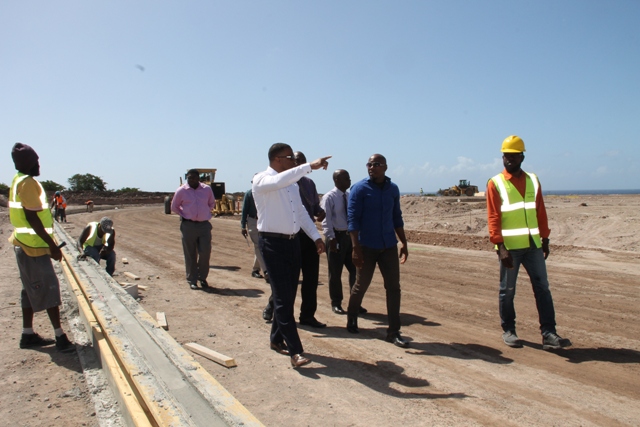Hon. Mark Brantley with Cabinet colleagues and senior officials in the Nevis Island Administration touring the construction site of the Mondo athletic track at Long Point on February 08, 2017