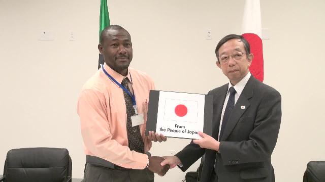 (l-r) Director of the Nevis Disaster Management Department Mr. Brian Dyer accepts documents for grant funds from Mr. Masatoshi Sato, Minister-Counsellor and Deputy Head of Mission at the Embassy of Japan to St. Kitts and Nevis at a signing ceremony at the Emergency Operations Centre, Long Point on March 15, 2017