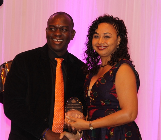 Kerry Hendrickson accepts the Ministry of Tourism’s Hotel Manager of the Year Award from Mrs. Sharon Brantley, wife of Ministry of Tourism Hon. Mark Brantley, at the ministry’s annual Tourism Awards Gala and Dance at the Four Seasons Resort on May 27, 2017