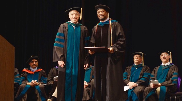 Hon. Mark Brantley, Deputy Premier of Nevis (right) with Dr. John P. Docherty, Chairman of the Board of Trustees of the Medical University of the Americas and the Saba University of Medicine, moments after he presented Mr. Brantley with an honorary Doctor of Laws degree at the commencement ceremony, at the Veterans Memorial Auditorium in Rhode Island, USA, on June 03, 2017