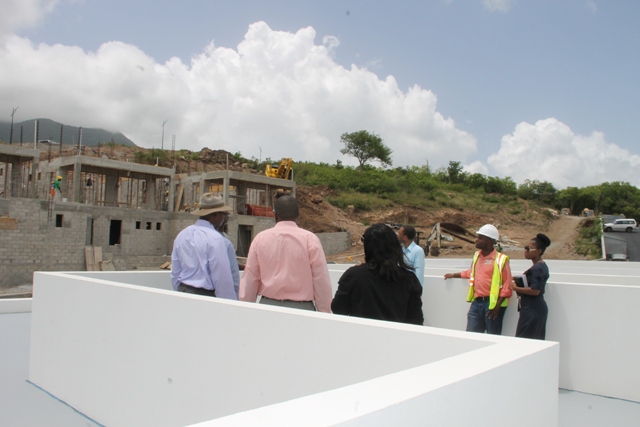 A team from the Ministry of Communication and Works and the Physical Planning Department visiting the Nevisian Sunset Project at Colquhoun Estate above the village of Cotton Ground on June 13, 2017