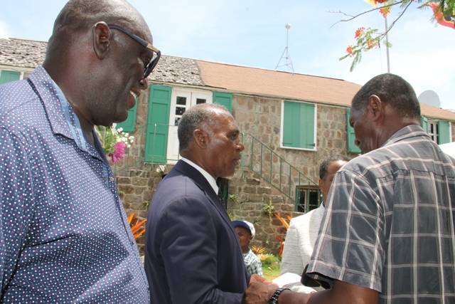 Dr. Whitman Browne, Nevisian author of three publications on the M.V, Christena Disaster in 1970 (right) with Premier of Nevis Hon. Vance Amory (middle) at the Memorial Service at the Alexander Hamilton Museum Grounds on August 01, 2017, commemorating the 47th anniversary of the disaster. Survivor Oswald “Ossie” Tyson looks on