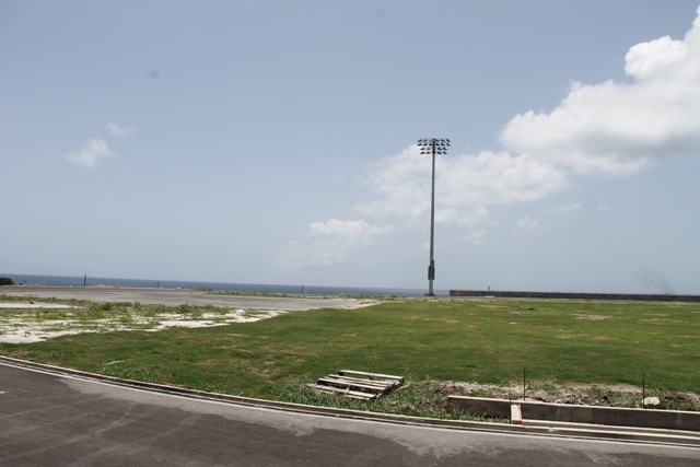 A section of the four-pole lighting system installed and commissioned by Mosco Sports Lighting in the United States of America and a section of the grass area at the Mundo Track Project at Long Point 