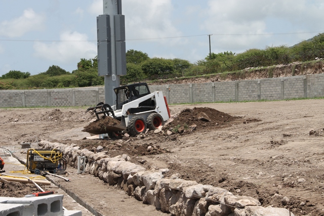 A Nevisian stone wall under construction on August 22, 2017, at the eastern section of the Mundo Track facility at Long Point