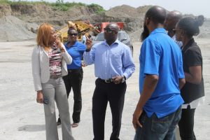 Hon. Alexis Jeffers, Minister of Housing and Land on Nevis (middle) speaks to Mrs. Elreter Sampson-Browne, General Manager of the National Housing Corporation in St. Kitts and her team, during a tour of the Nevis Island Administration-owned quarry at New River on October 18, 2017