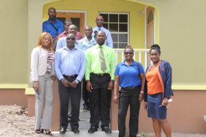 Members of the National Housing Corporation in St. Kitts including Mr. Valentine Lindsay, Chairman of the National Housing Corporation ( front row third from right), General Manager Mrs Elreter Sampson-Browne (front row left) and the Nevis Housing and Land Development Corporation on a tour at the Cedar View Development Project at Maddens on October 18, 2017, led by Hon. Alexis Jeffers, Minister of Housing and Lands on Nevis (front row second from left) and Dexter Boncamper, Manager of the Nevis Housing and Lands Development Corporation (back row left)