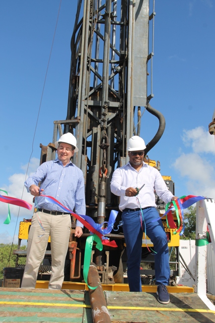 (l-r) Mr. Dan Pfeffer, President of the Nevis Renewable Energy International (NREI) and Hon. Mark Brantley, Acting Premier of Nevis cut the ribbon to signal the start of drilling a test well at Hamilton Estate on November 22, 2017