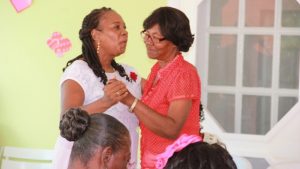 Mrs Garcia Hendrickson (left), outgoing Coordinator of the Department of Social Services Senior’s Division in the Ministry of Social Development on Nevis at a Valentine’s Day celebration hosted by the Ministry of Social Development in the Nevis Island Administration for seniors in February 2016 (file photo)