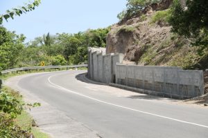 A section of the 300 feet retaining wall constructed at Fenton Hill to mitigate the occurrence of rock fall hazard was constructed in the in the Improving Disaster Resilience and Emergency Shelter Management Project funded by the government and people of Japan