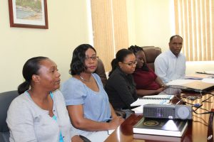 Ministry of Finance staff at the Budget Estimates meeting at the Ministry of Finance conference room on January 09, 2018. (L-r) Mrs. Jasmine Brazier, Economist; Mrs. Joan Browne, Principal Assistant Secretary in the Ministry of Finance; Ms. Shakeemia Browne and Ms. Abaena Simon, Budget Analysts and Mr. Colin Dore, Permanent Secretary in the Ministry of Finance