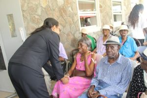Senator Wendy Phipps, Minister of State in the Ministry of Health in the Federal Government interacting with seniors including three centenarians (second row) at the Flamboyant Nursing Home on Nevis during the 106th birthday celebration of Ms. Celian “Martin” Powell, the Federation’s eldest living centenarian on January 19, 2018