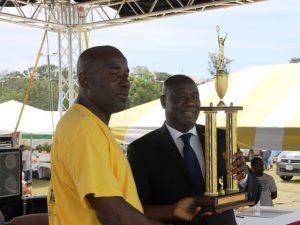 Mr. Mclean Moore of the Indian Castle Fisher Folk Association receives an award on behalf of the association named top Fisher for 2017 from Minister of Agriculture Hon. Alexis Jeffers at the Department of Agriculture at the at its 24th Annual Agriculture Open Day Opening Ceremony on March 22, 2018 at the Villa Grounds in Charlestown