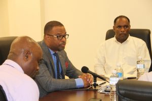 Hon. Mark Brantley, Premier of Nevis and Minister of Finance addressing members of the Nevis Chapter of the St. Kitts and Nevis Chamber of Industry and Commerce at Pinney’s Estate on March 13, 2018. He is flanked by Mr. Stedmond Tross, Cabinet Secretary and Special Advisor to the Nevis Island Administration (left) and Mr. Colin Dore, Permanent secretary in the Ministry of Finance (right)