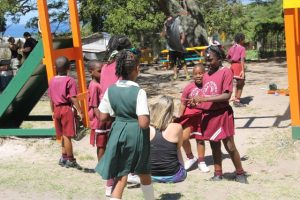 A member of the Galderma Group visiting Nevis interacts with students at the Ivor Walters Primary School at Brown Hill on February 28, 2018