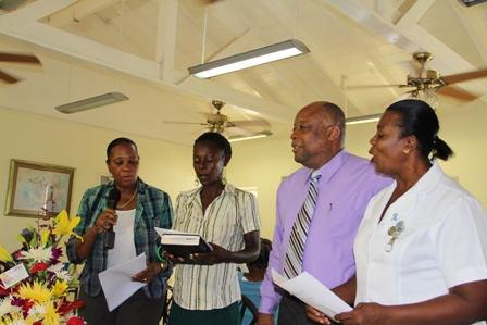 (L-R) Director of the Senior Citizens Division Mrs Garcia Hendrickson, Officer in the Division Ms, Angela Challenger, Minister of in the Ministry of Social Development Hon. Hensley Daniel and Assistant Nurse Manager at the Flamboyant Nursing Home Ima Stanley singing a hymn during the birthday celebration of Mrs. Lucina Brown at the Flamboyant Nursing Home