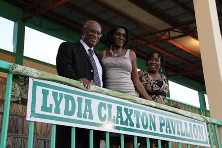 Premier of Nevis Hon. Joseph Parry with honouree Mrs. Lydia Claxton and her friend Mrs. Jeanette Maloney, moments after a stand at the Grell-Hull-Stevens Netball Complex was named in her honour