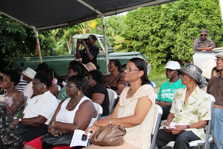 More residents of Barnes Ghaut Village listen attentively at the handing over ceremony of the Barnes Ghaut Adult Education Centre