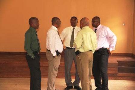 Cabinet members in the sitting Nevis Island Administration (l-r) Cabinet Secretary and Jessups Villager Mr. Ashley Farrell, Premier of Nevis and Area Representative Hon. Joseph Parry, Minister of Trade Hon. Dwight Cozier, Minister of Communication and Works Hon. Carlisle Powell and  Minister of Social Development Hon. Hensley Daniel discussing progress of the Jessups Community Centre