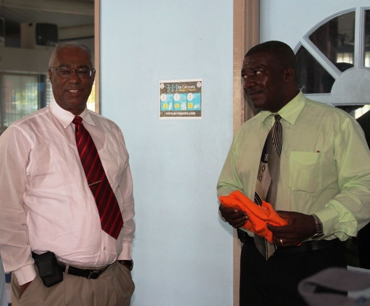 Premier, Hon. Joseph Parry and Charlestown Secondary School Headmaster, Mr. Edson Elliott 