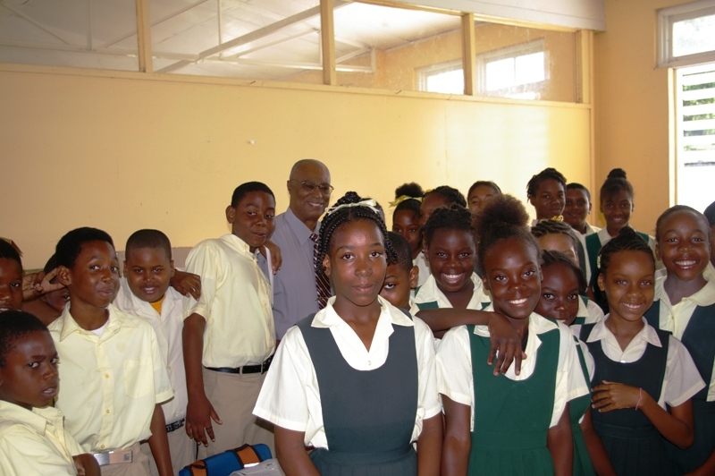 Premier, Hon. Joseph Parry with children of the Ivor Walters Primary School children  