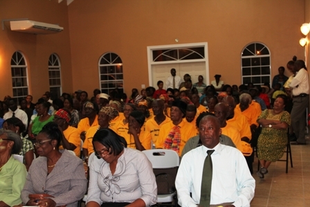 Cabinet Secretary in the Nevis Island Administration and Jessups Villager Mr. Ashley Farrell (first row extreme right) seated among those present at the official opening of the state of the art Jessups Community Centre