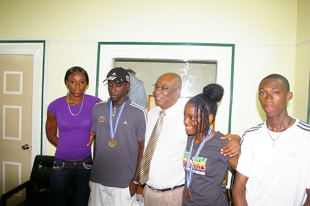 Premier of Nevis, Hon. Joseph Parry with the Nevisian Athletes, Brittany Morton,Adrian Williams,Renika Daniel and Izaun Ward