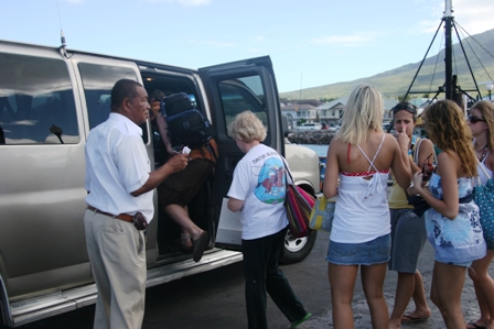 Visitors to Nevis enter a waiting taxi (file photo)