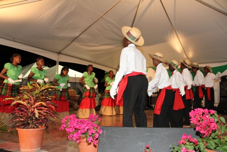 Jazz Saxophonist Mr. Lloyd Williams performs accompanied by Nevisian drummers on African drums at the official opening ceremony of the Nevis Performing Arts Centre on April 28, 2012