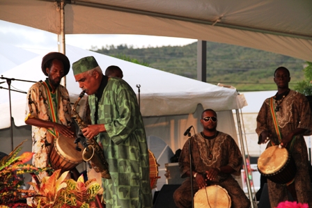 Jazz Saxophonist Mr. Lloyd Williams performs accompanied by Nevisian drummers on African drums at the official opening ceremony of the Nevis Performing Arts Centre on April 28, 2012