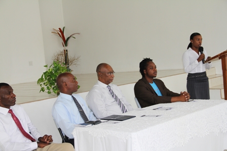 Head table at the Creativity for Employment and Business Opportunity Youth Training Workshop (l-r) Pastor Eversley Pemberton, Permanent Secretary in the Ministry of Social Development and Youth on Nevis Mr. Alsted Pemberton, Premier of Nevis and Minister of Social development and Youth Hon. Joseph Parry and Senior Youth Officer in the Department of Youth Empowerment in St. Kitts Mr. Pierre Liburd. Youth Coordinator in Nevis Mrs. Diane Pemberton is at the podium