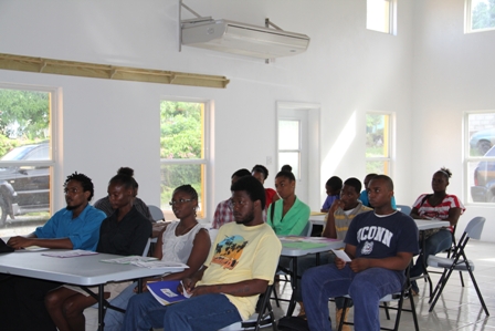 Participants at the Creativity for Employment and Business Opportunity Youth Training Workshop with a facilitator Mr. Irvin Welsh seated on the extreme left