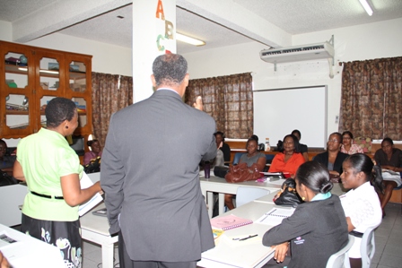 Minister of Education and Premier of Nevis Hon. Vance Amory visits with Grade 2 teachers attending a reading workshop while at the Ministry of Education at Marion Heights