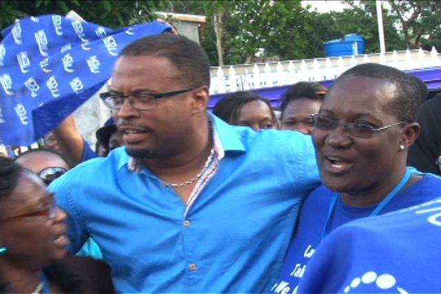 Deputy Leader of the Concerned Citizens Movement Mr. Mark Brantley celebrates his victory at the polls with elated supporters outside party headquarters in Charlestown