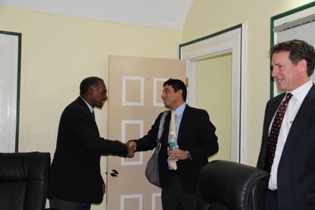 Premier of Nevis welcomes Organization of American States team (l-r) Project/Programme Manager and Sustainable Development Specialist at the Department of Sustainable Development at the OAS Mr. Kevin de Cuba and Division Chief for Energy and Climate Change in the Department of Sustainable Development Mr. Mark Lambrides to his Bath Hotel office at Bath Plain