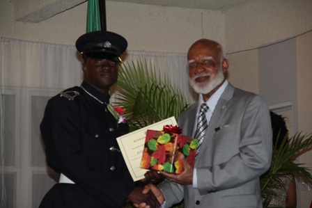 Third runner up for title of Constable of the Year in the Royal St. Christopher and Nevis Police Force Constable #755 Derell Boon of the Gingerland Police Station receiving his recognition gift from Governor General of St. Kitts and Nevis His Excellency Edmund Lawrence