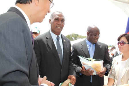 Premier of Nevis Hon. Vance Amory (second from left) and Minister of Agriculture Hon. Alexis Jeffers (second from right) visit the display booth of the Republic of China (Taiwan)’s Agricultural Mission with Ambassador of the Republic of China (Taiwan) to St. Kitts and Nevis His Excellency Miguel Li-Jey Tsao (extreme left) at the 19th annual Agriculture Open Day at the Villa Grounds in Charlestown hosted by the Department of Agriculture on March 21, 2013