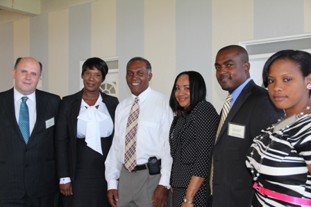 (L-R) Mr. Ernie Dover, Advisor at the Financial Services Regulation Supervision Department Ms. Heidi-Lynn Sutton, Premier of Nevis and Minister of Finance in the Nevis island Administration Hon. Vance Amory, Regulator Ms. Lyndis Wattley, Managing Director of KAM Management Services Ltd. of Antigua Mr. Kem Warner and Registrar, International Insurance Ms. Ameilia Jones