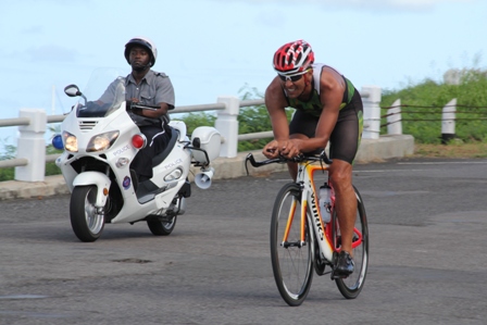 Winner of the first ever MaccaX Nevis International Triathlon Chris McCormack held in Nevis on November 16, 2013 cycling round the island