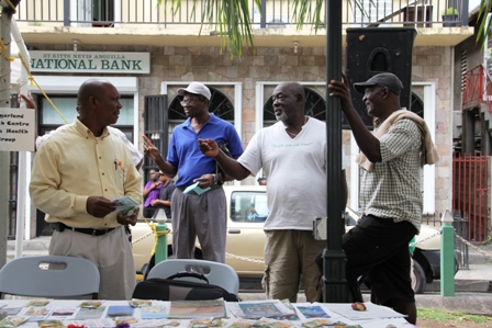 Patrons at the health fair for men hosted by the Ministry of Social Development through its Gender Affairs Unit to mark International Men’s Day at the Memorial Square on November 19, 2013