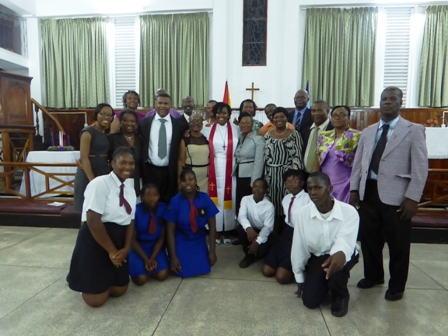 Newly ordained Methodist Minister Reverend Amica Liburd with a contingent of family, friends and well wishers who travelled to Guyana to witness her ordination at the Kingston Methodist Church in Georgetown Guyana on December 08, 2013(Photo by Laurence Richards)